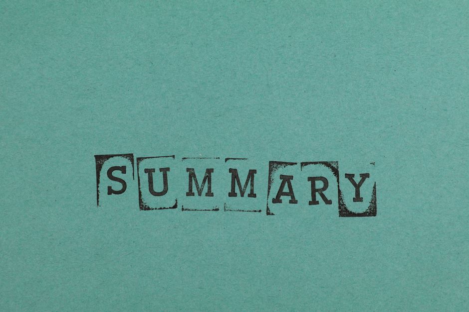 Close-up of the word 'SUMMARY' stamped on a green paper surface, offering ample copy space.